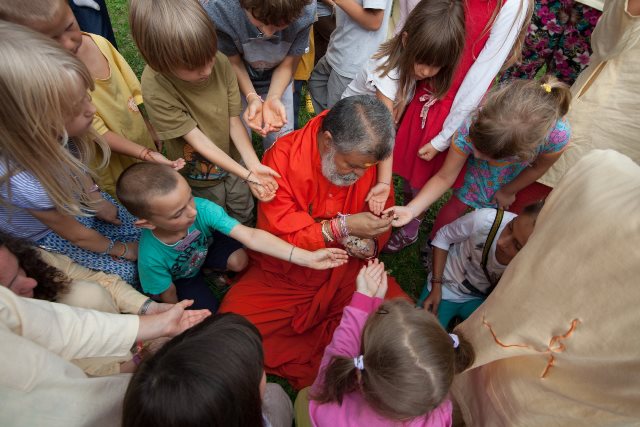 Swami Maheshwarananda celebrating Raksha Bandhan with children